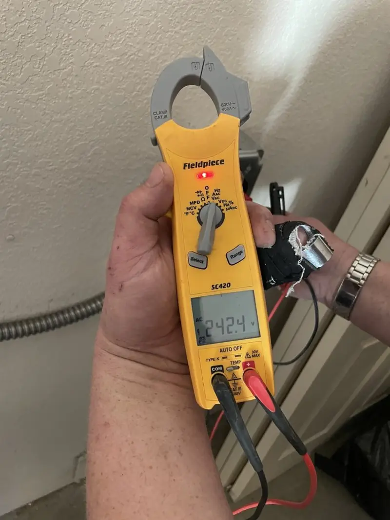 Voltage testing with clamp meter during Outlet Installation in Rushville